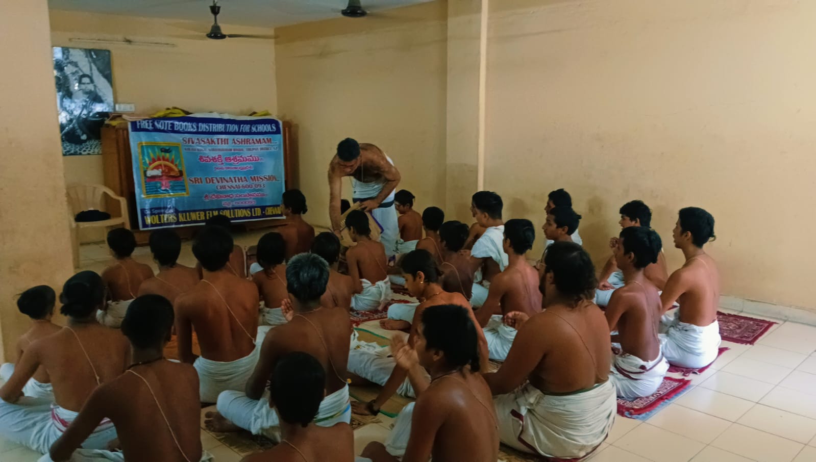 Veda students seated during a teaching session