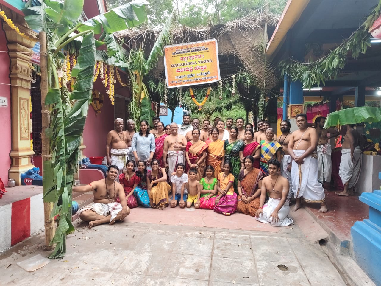 Devotees of different ages gathered at the ashram entrance