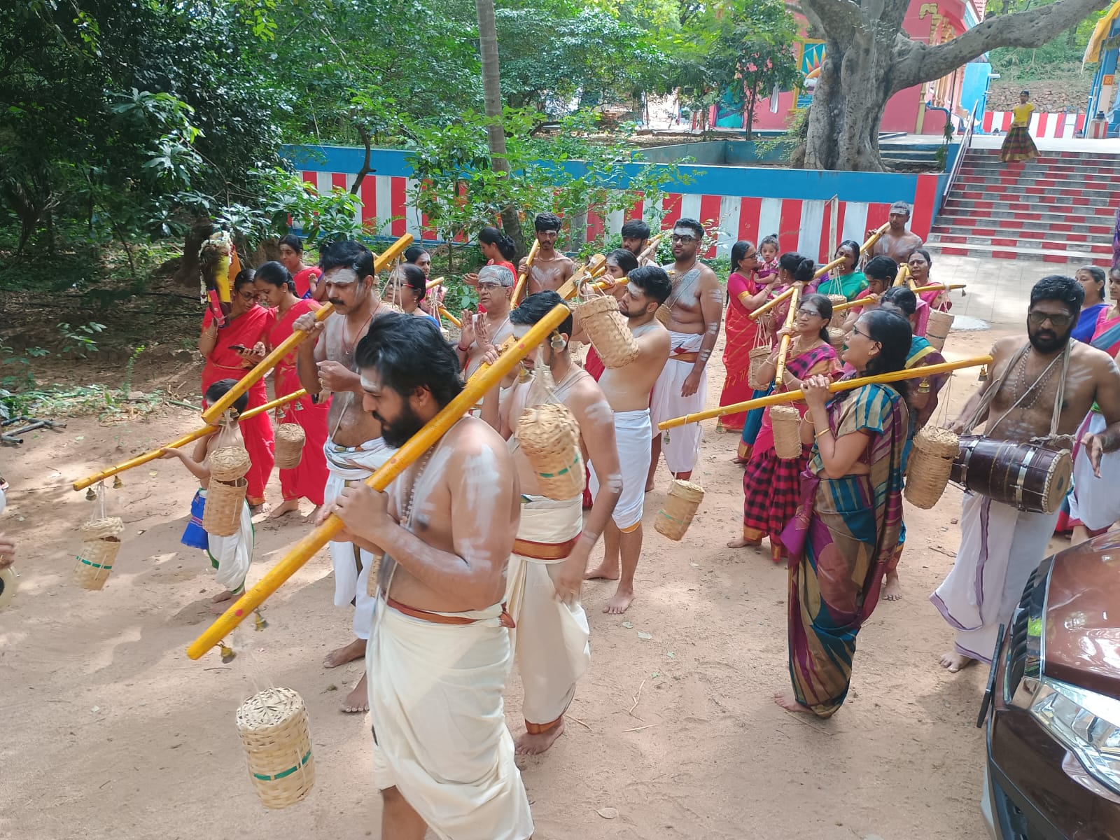 Devotees walking in procession along the temple grounds